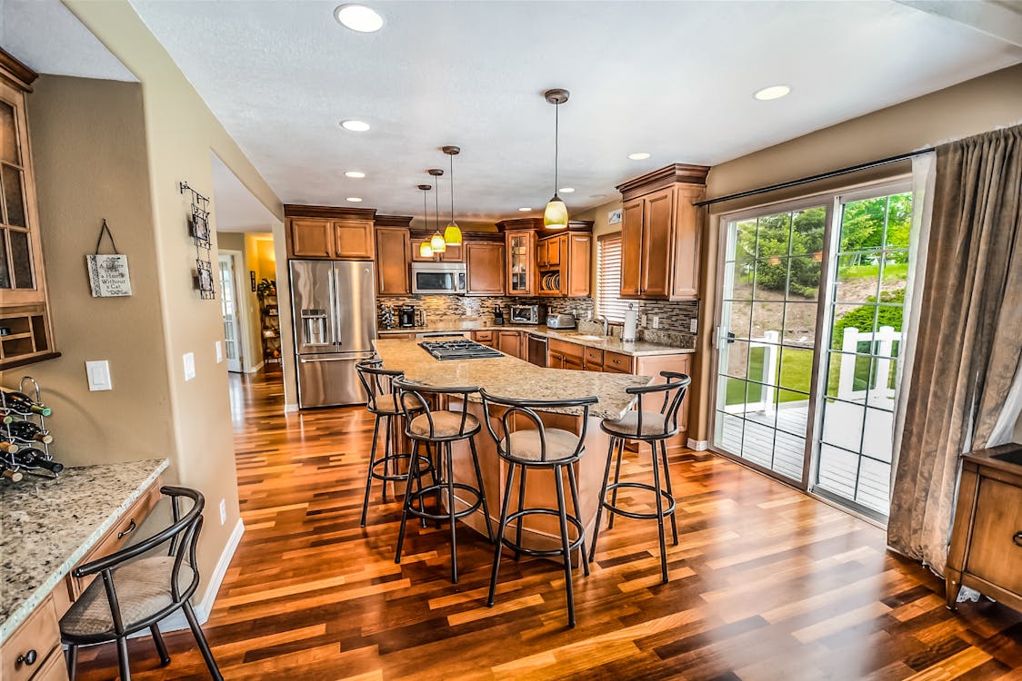 The beautiful exterior of a modern suburban home in Columbus on a bright, sunny day, showcasing excellent curb appeal for potential home sellers.