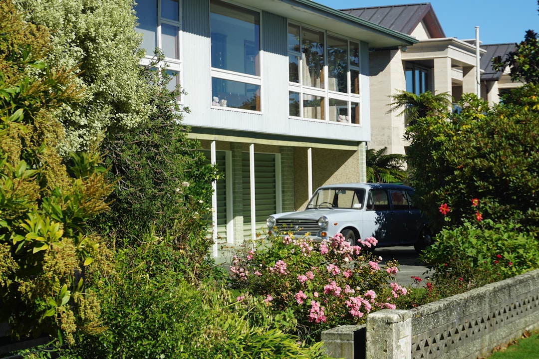 The clean, inviting exterior of a modern suburban home in a neighborhood like those in Columbus, Indiana, on a bright, sunny day.