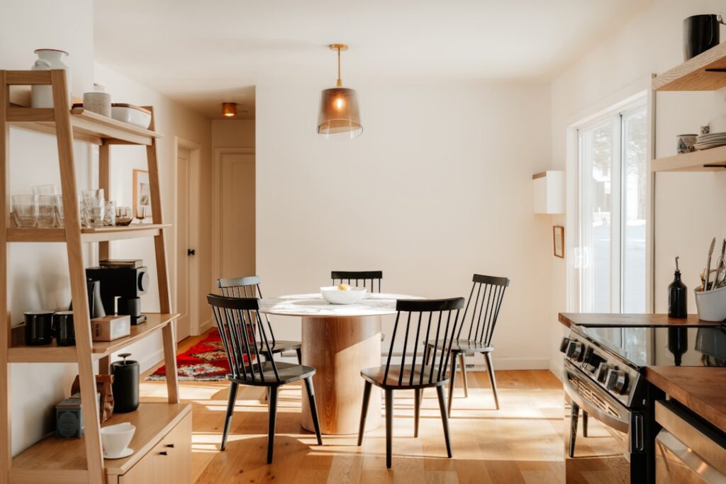 Savvy homeowner carefully reviews architectural blueprints for a kitchen remodel, representing a smart, ROI-focused home i...