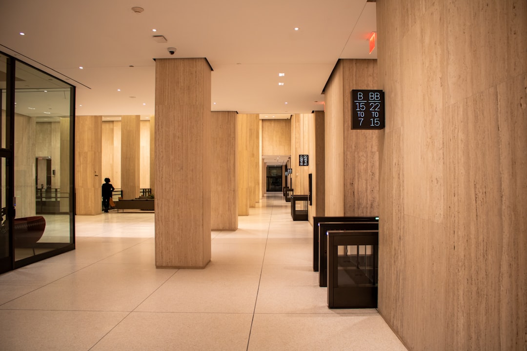 A bright and empty modern corporate office, symbolizing the unnecessary and costly overhead baked into traditional real estate commissions.