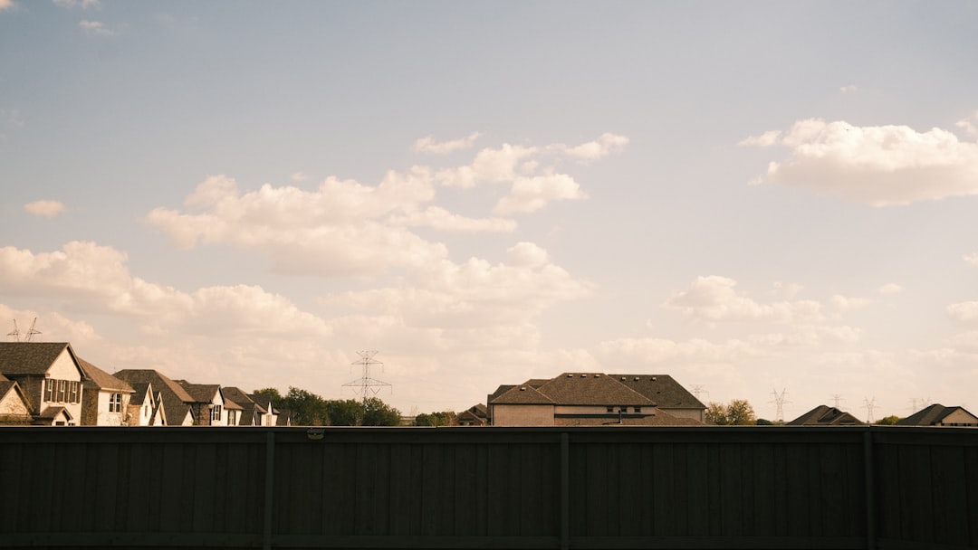 A beautiful modern suburban home in Columbus, Indiana, with great curb appeal on a sunny day, representing the high-value properties being sold.