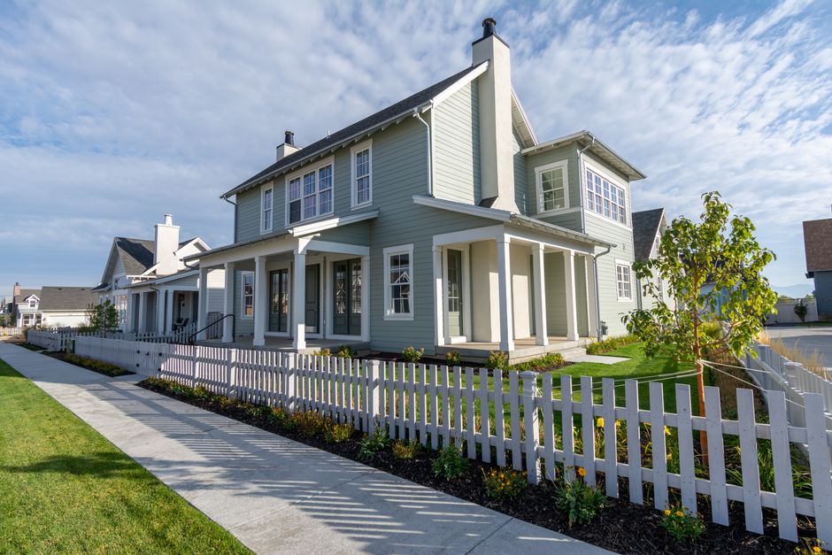 The front exterior of a beautiful, modern suburban home in the American Midwest on a bright, sunny day, representing a homeowner's valuable equity.