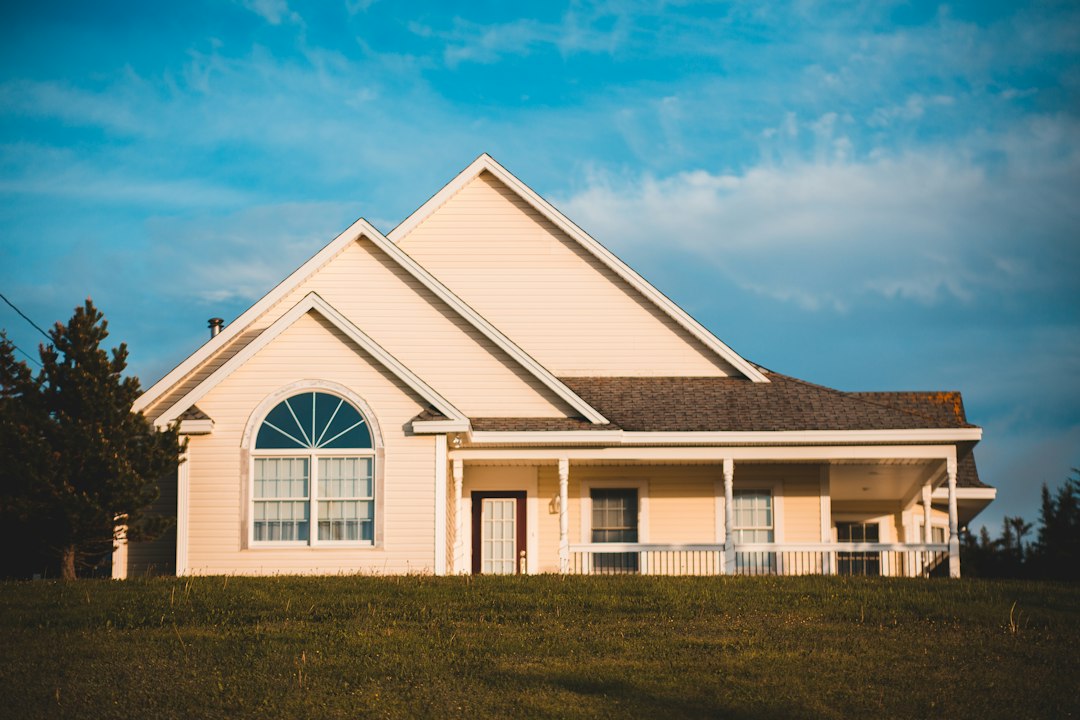 A classic suburban Columbus-style home with a large, transparent percentage sign graphic overlaid, visually representing the high cost of traditional real estate commission fees.